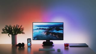 Flat screen computer monitor on wooden desk